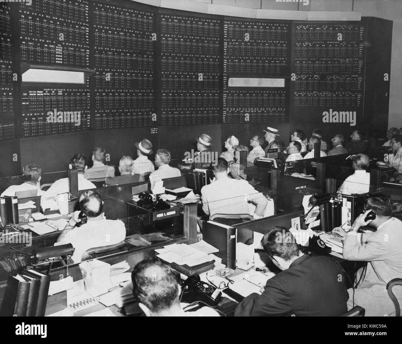 Big board in Merrill Lynch, Pierce, Fenner & Beane's office at 148 Pierrepont Street in Brooklyn. Stockholders and brokers keep current without commuting into Wall Street in Manhattan. July 1956. (BSLOC_2015_14_151) Stock Photo