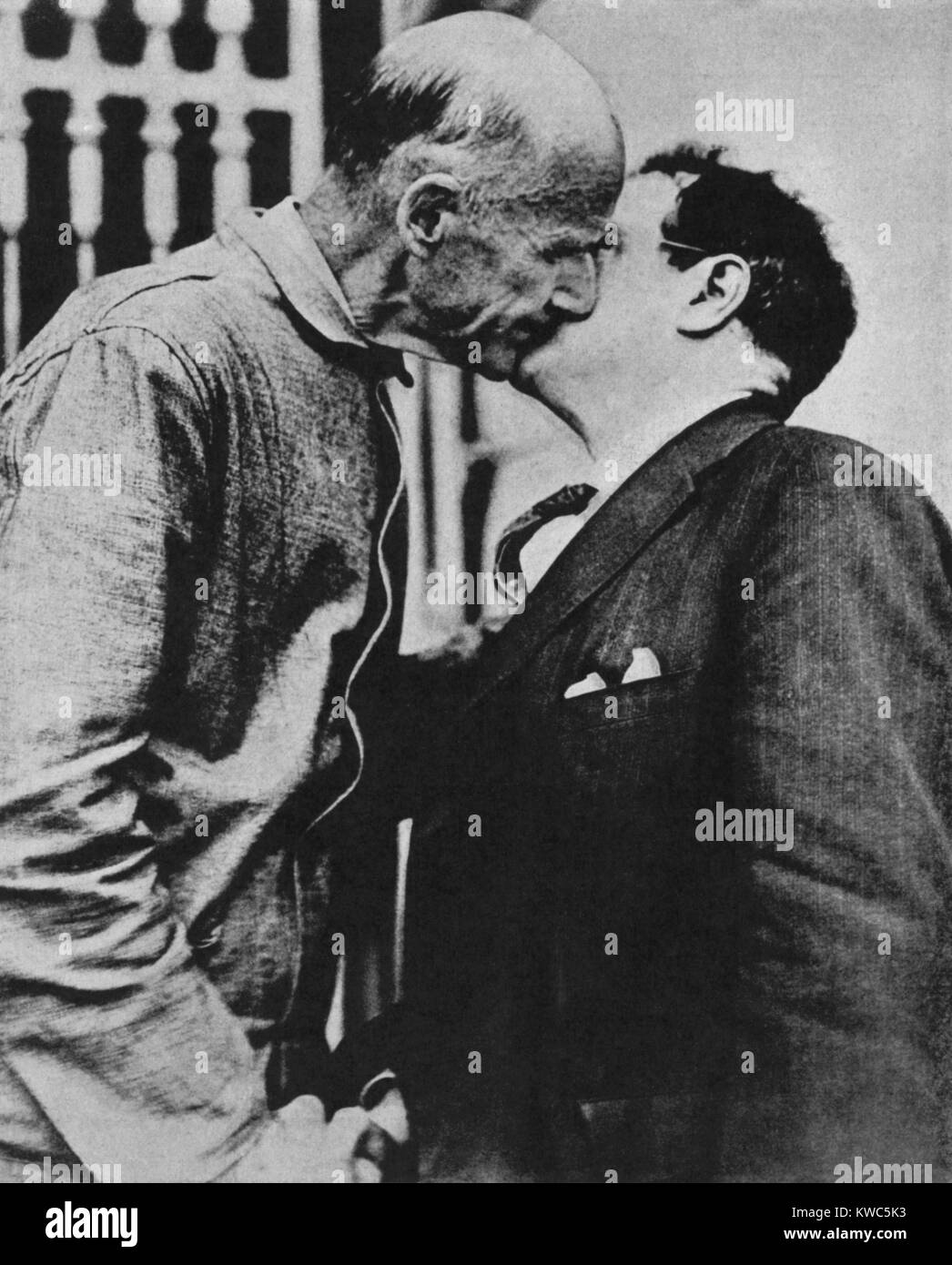Seymour Stedman, and Eugene Debs shake hands and kiss at Atlanta Federal Penitentiary, 1920. Stedman notified Debs of his nomination as the Socialist Party's nominee for President, for which he ran from jail and won almost one million of 27 million votes cast. Leftist Labor Leader and Socialist politician Eugene Debs was serving a 10-year sentence for publicly opposing U.S. entry into World War 1. (BSLOC 2015 15 183) Stock Photo