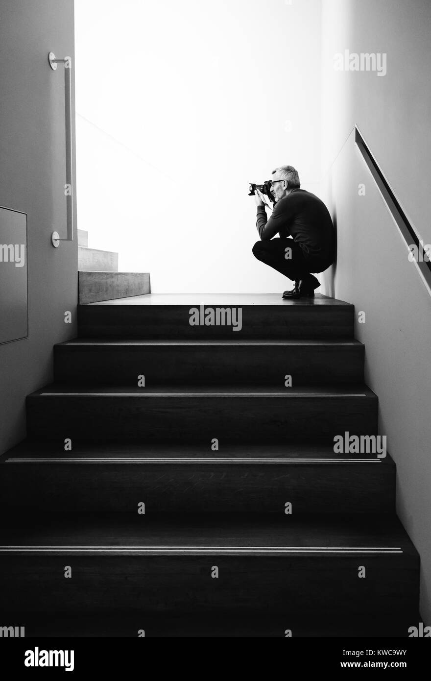 Amsterdam, Netherlands - August 3, 2016: Visitor in the interior of Rijksmuseum  taking photos in staircase Stock Photo