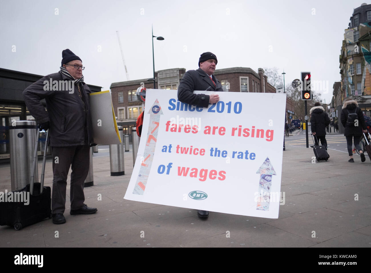 Campaigners protest against rail fare increases outside King's Cross station in London. Stock Photo