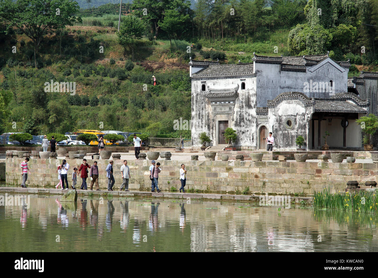Tourists on the bank of lake in Shexian town, China Stock Photo