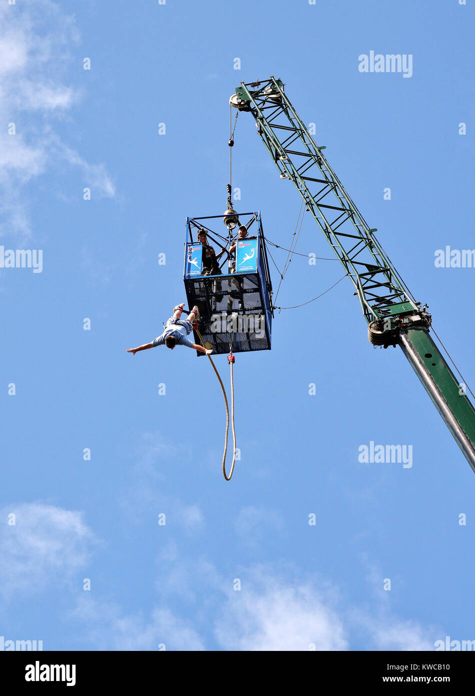 Bungee Jumper leaping from a platform attached to a hoist Stock Photo