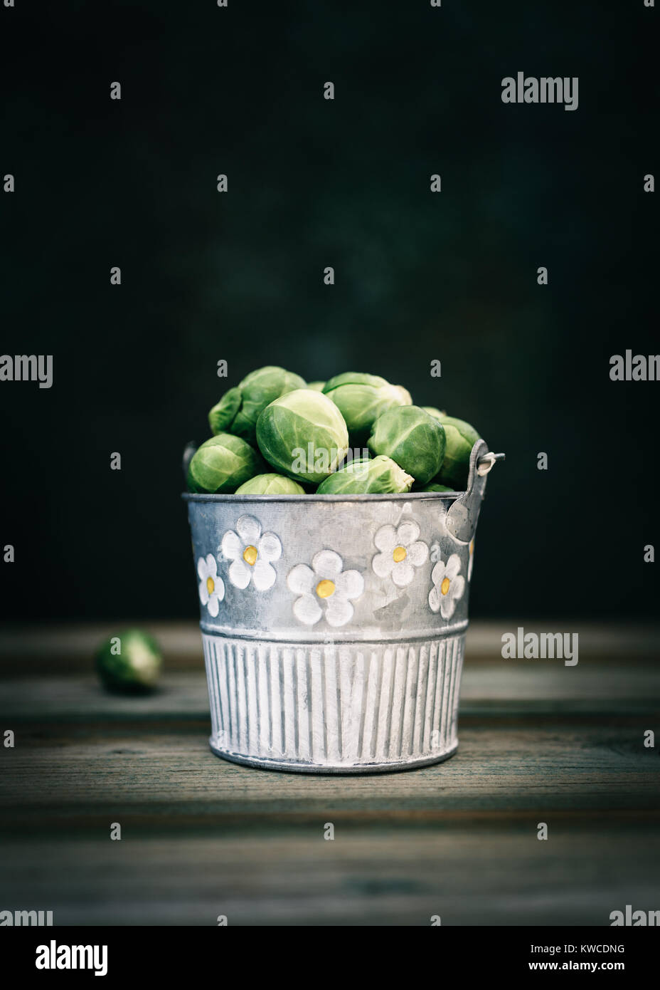 Fresh Brussels sprouts in metal bucket Stock Photo
