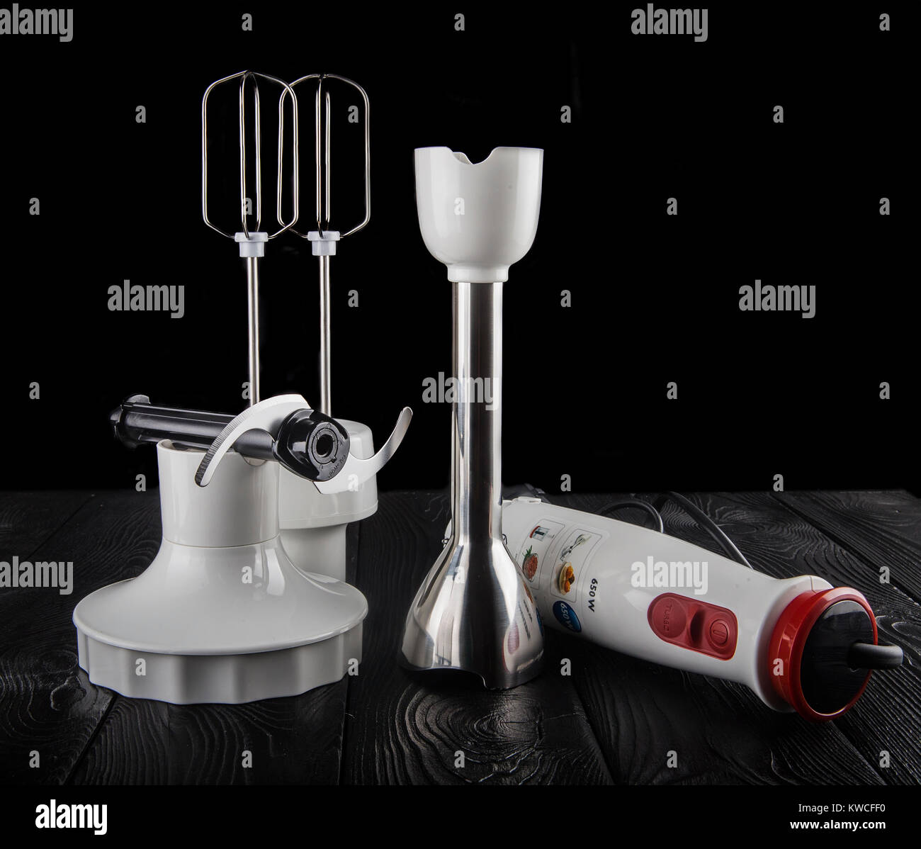 Electric hand blender, isolated on a black background. Stock Photo