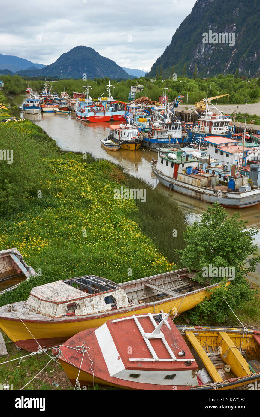 Colourful fishing boats in a creek in the coastal town of Puerto Aysen in northern Patagonia, Chile Stock Photo