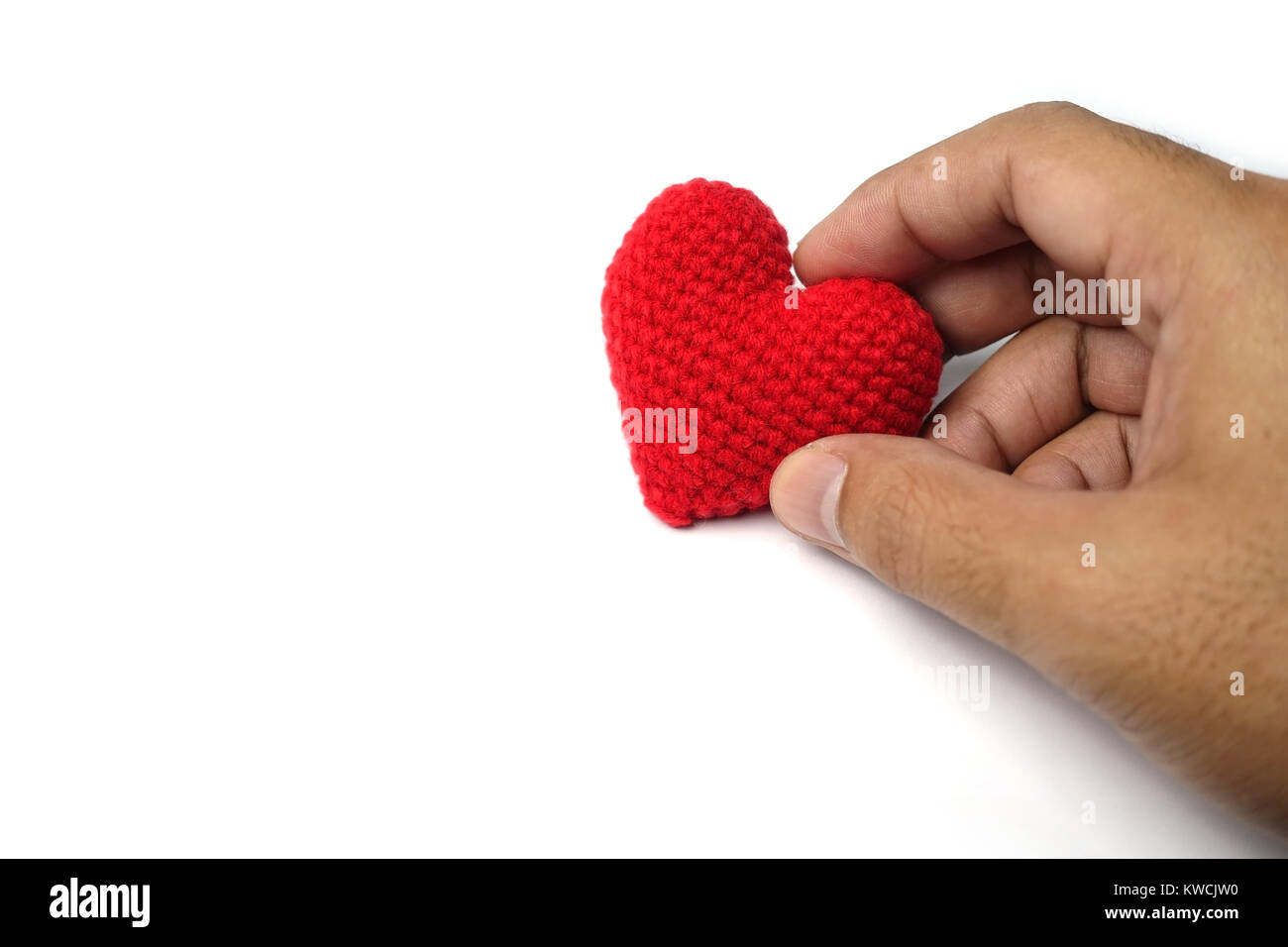 hand holding red heart on a white background Stock Photo - Alamy