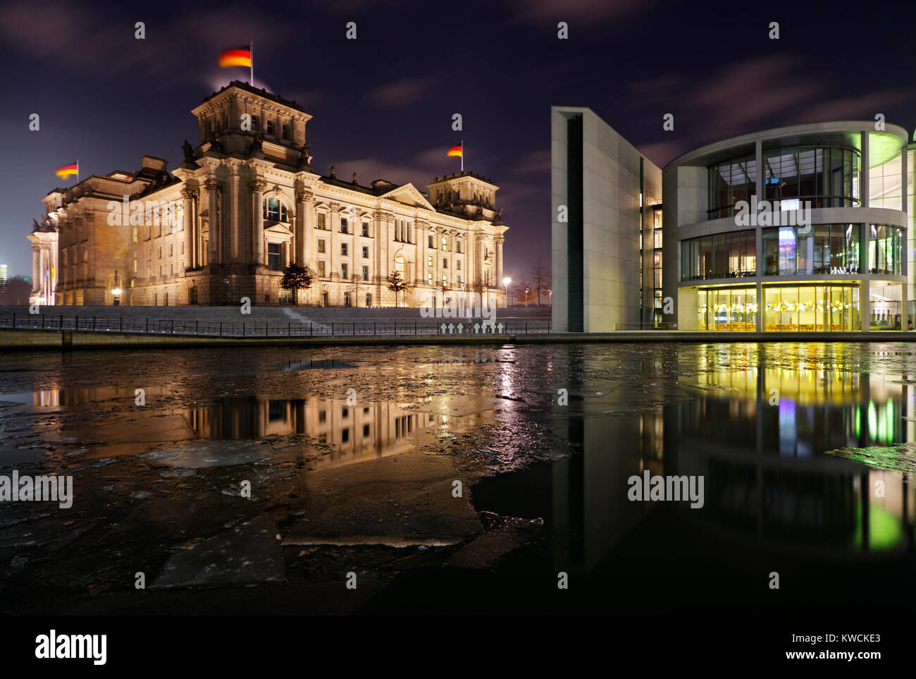 The German Reichstag and another government building at night with ice floes on the Spree. Stock Photo