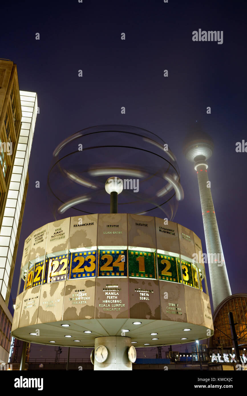 The famous world time clock and the TV tower at Berlin Alexanderplatz at night. Stock Photo