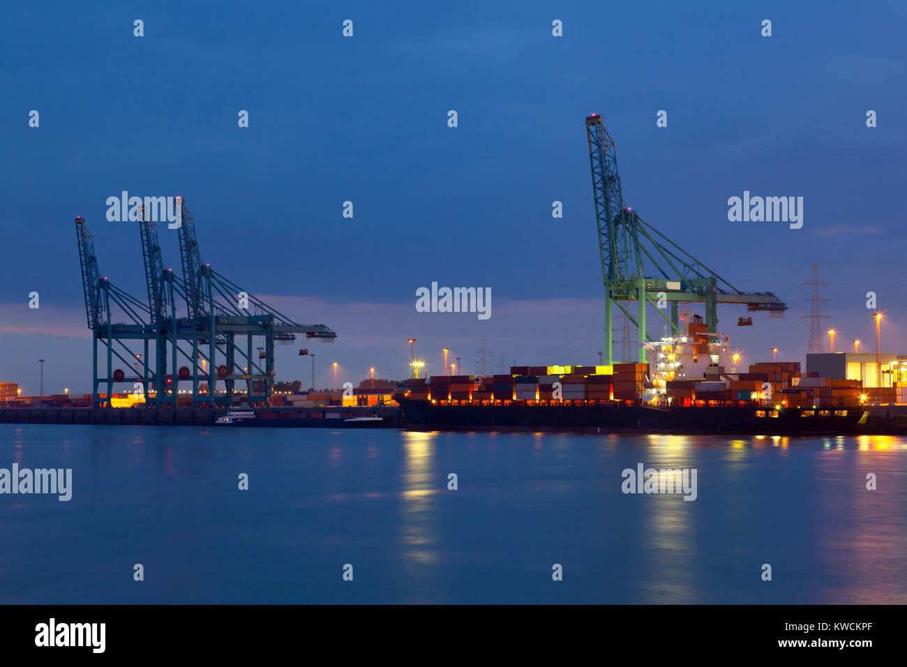 A container terminal with tall cranes. Night shot taken in Antwerp ...