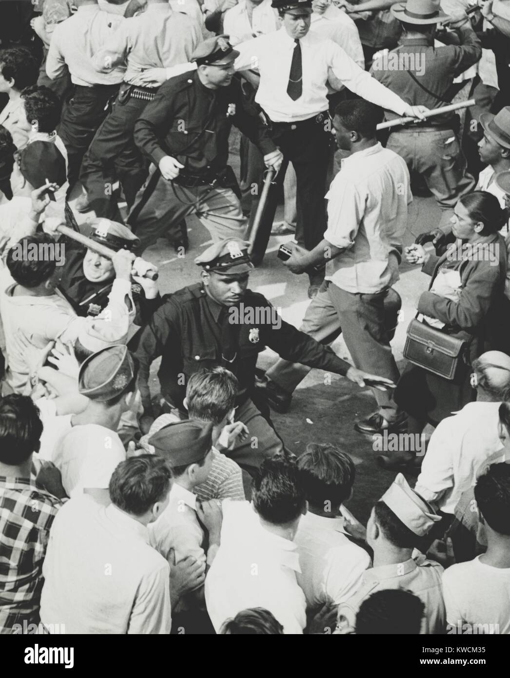 Peekskill Ny Riots Two lines of police hold back rioters, allowing attendees of the Paul ...