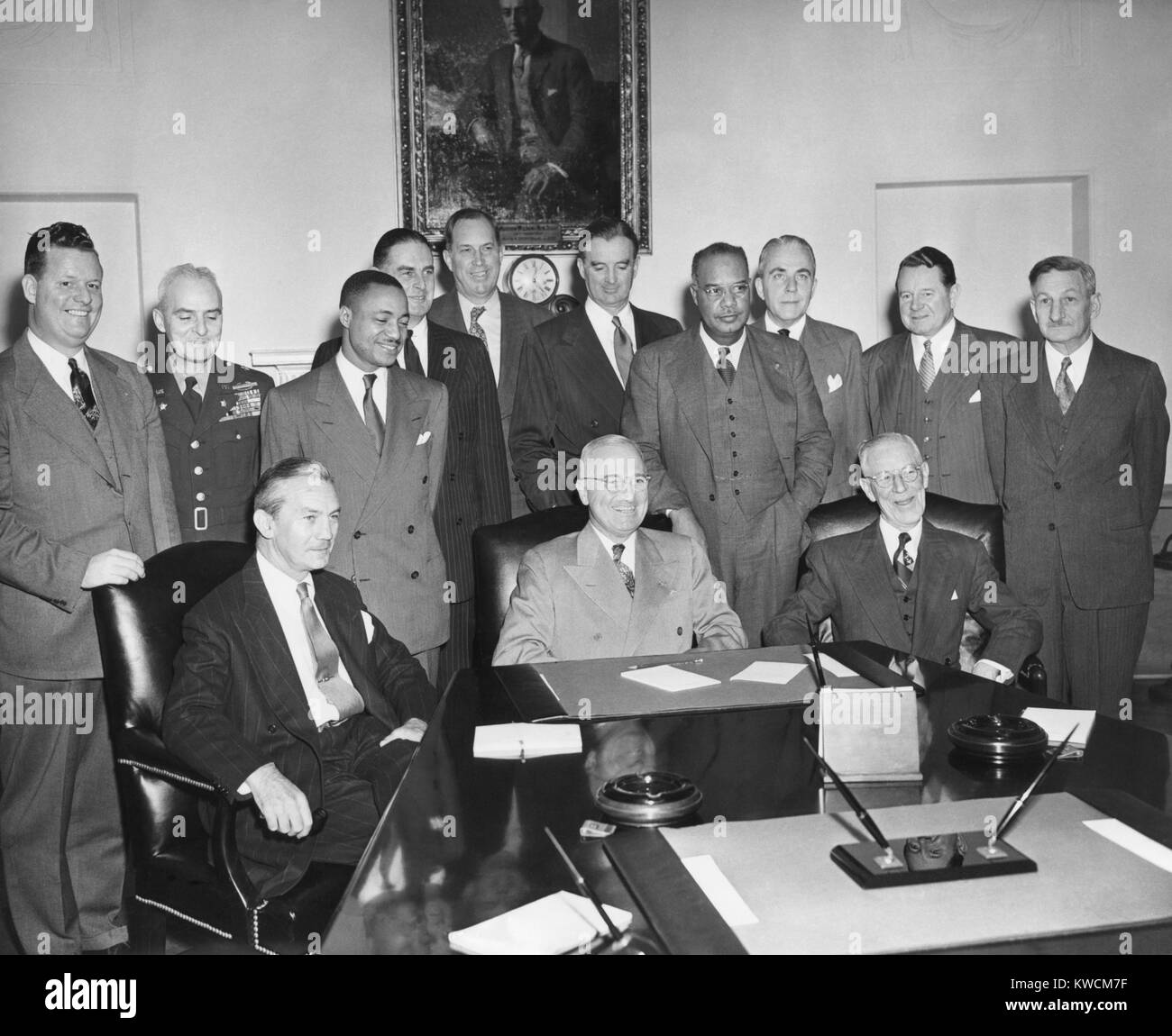 Pres. Truman desegregated the U.S. Military with Executive Order 9981, on July 26, 1948. Six months later he conferred with the Committee on Equality of Treatment and Opportunity, Jan. 12, 1949. Seated L-R: James Forrestal, Harry Truman, A.J. Donahue. Standing L-R: Thomas R. Reid; Gen. C.T. Lanhan; John H. Senzsacke; William E. Stevenson; Kenneth Royall; Stuart Symington; John L. Sullivan; Charles Fahy. - (BSLOC 2014 14 30) Stock Photo
