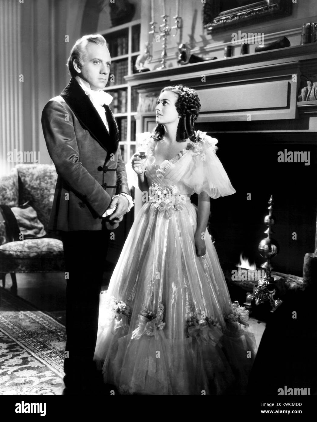 THEY ALL KISSED THE BRIDE, from left, Melvyn Douglas, Joan Crawford ...