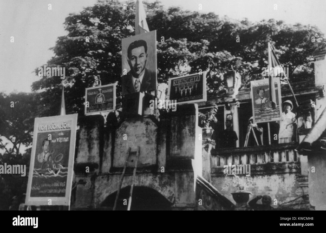 Peace ceremonies between the French Indo-Chinese Vietnam and the French emissaries in 1948. Posters show Bao Dai, the playboy king as 'head of state' of a nominally independent Vietnam. However, it was a protectorate with France controlling foreign relations and defense. - (BSLOC 2014 15 188) Stock Photo