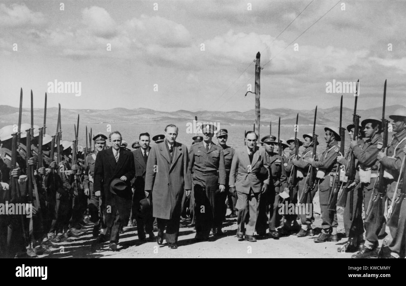 U.S. Gen. James Van Fleet and War Minister Kanellopoulos walk between lines of soldiers. They were visiting the notorious military prison at Makronisos Island during the Greek Civil War. Ca. 1948-49. - (BSLOC 2014 15 228) Stock Photo