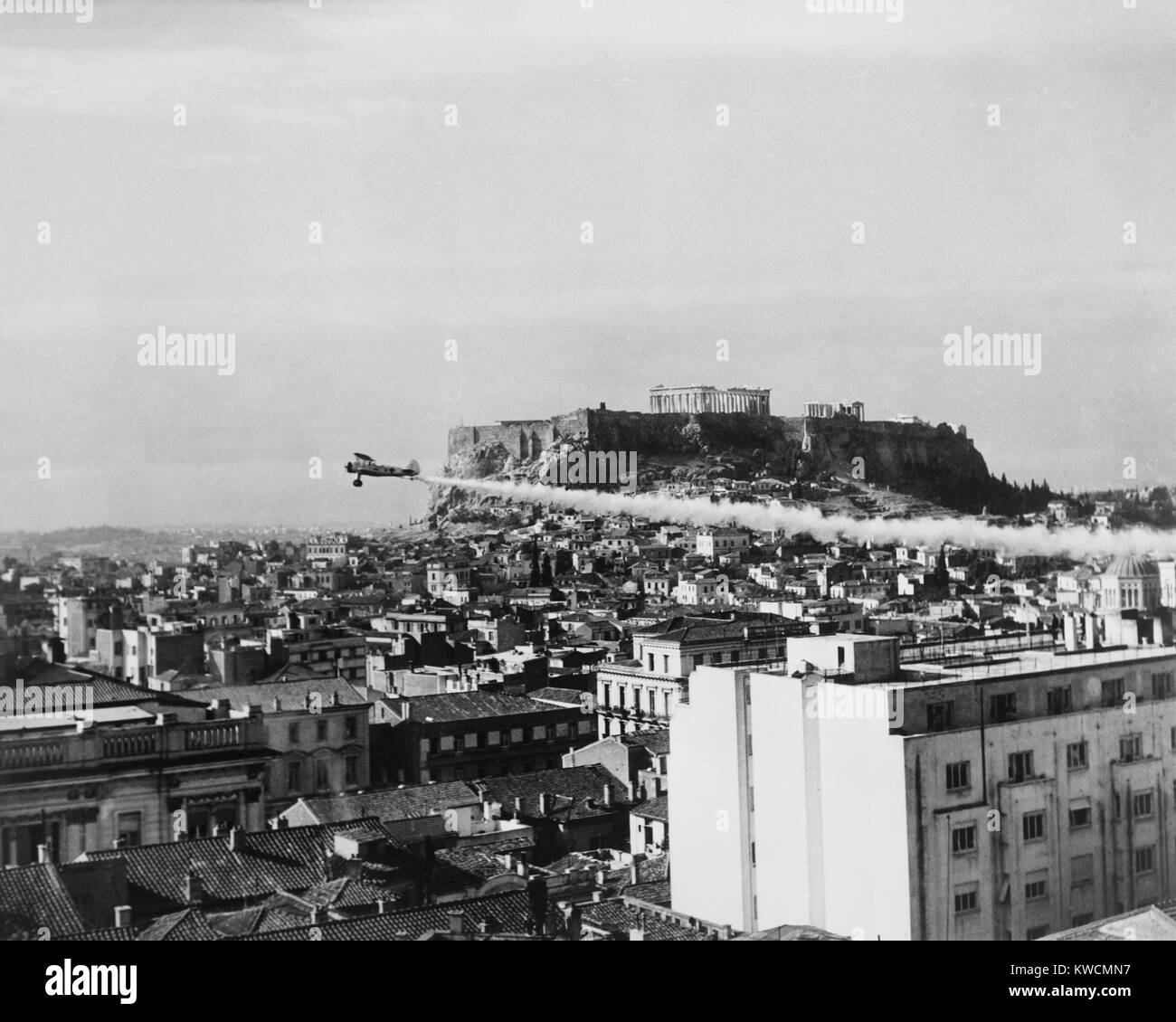 A plane dusts the ancient city of Athens with DDT prevent the spread of ...
