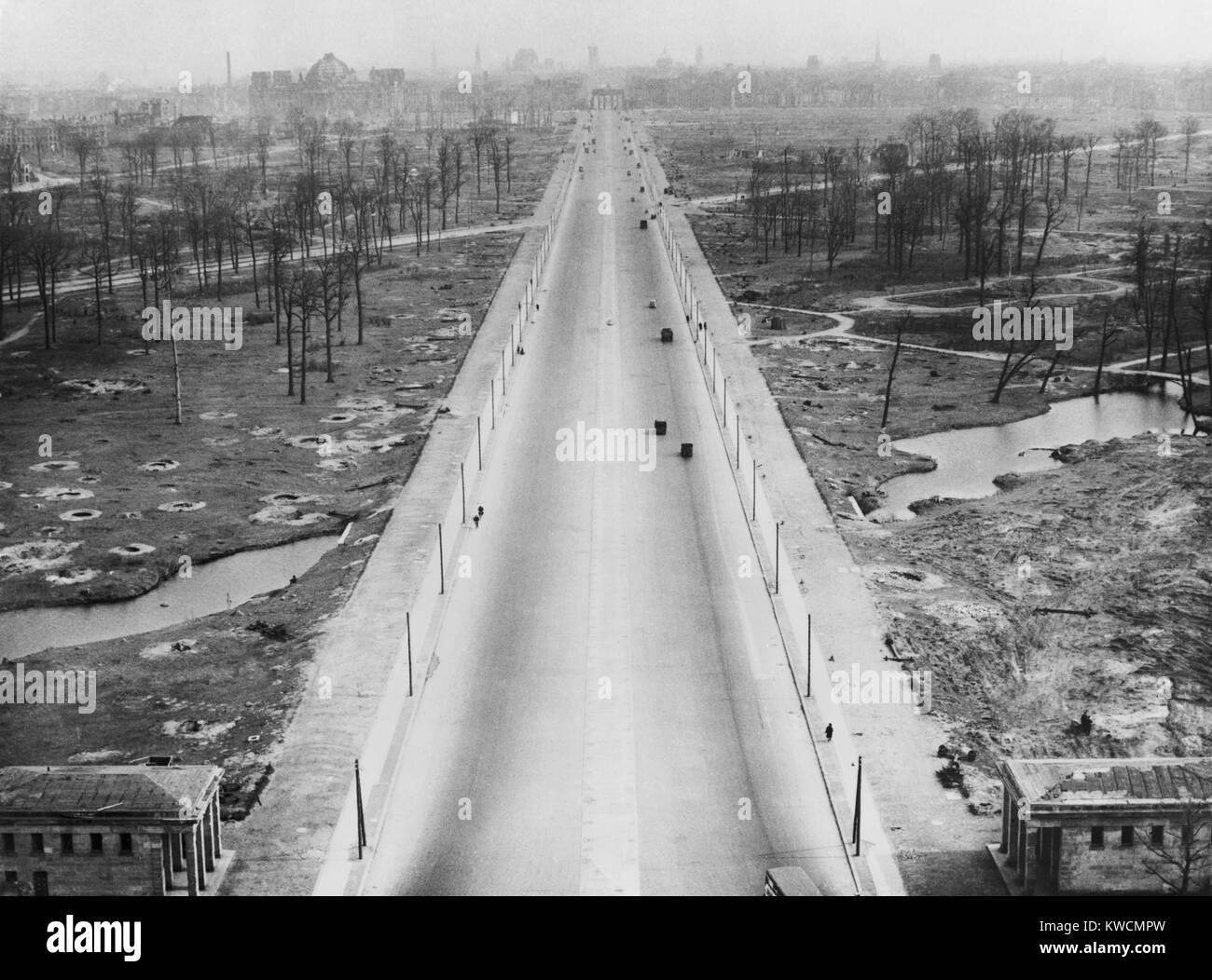 Tiergarten Park and the boulevard leading to the Brandenburg Gate after World War 2. The landscape is filled with bomb craters from the war. Berlin, Germany. Ca. 1945-46. - (BSLOC_2014_15_243) Stock Photo