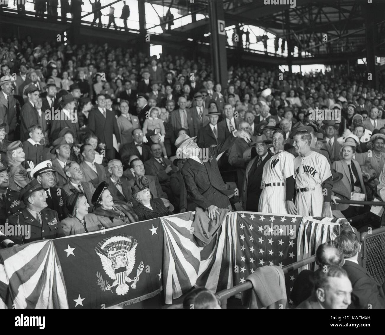 President Harry Truman tosses a baseball from the stands to open the ...