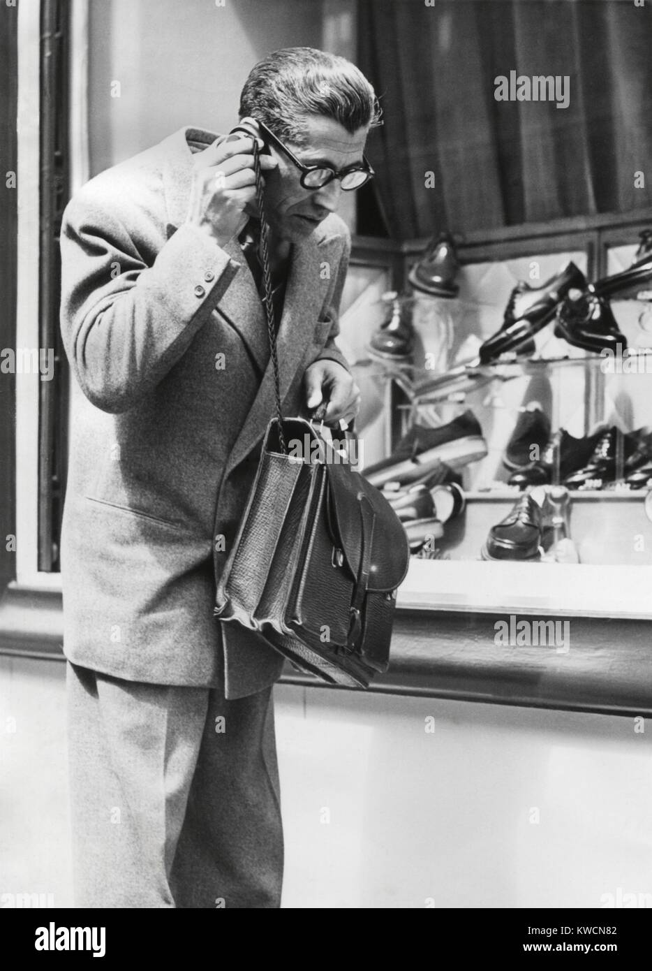 The 'Telephonogramme' in use of the streets of Paris, May 10, 1950. This was an early wireless mobile telephone that could fit into a briefcase. - (BSLOC_2014_17_110) Stock Photo