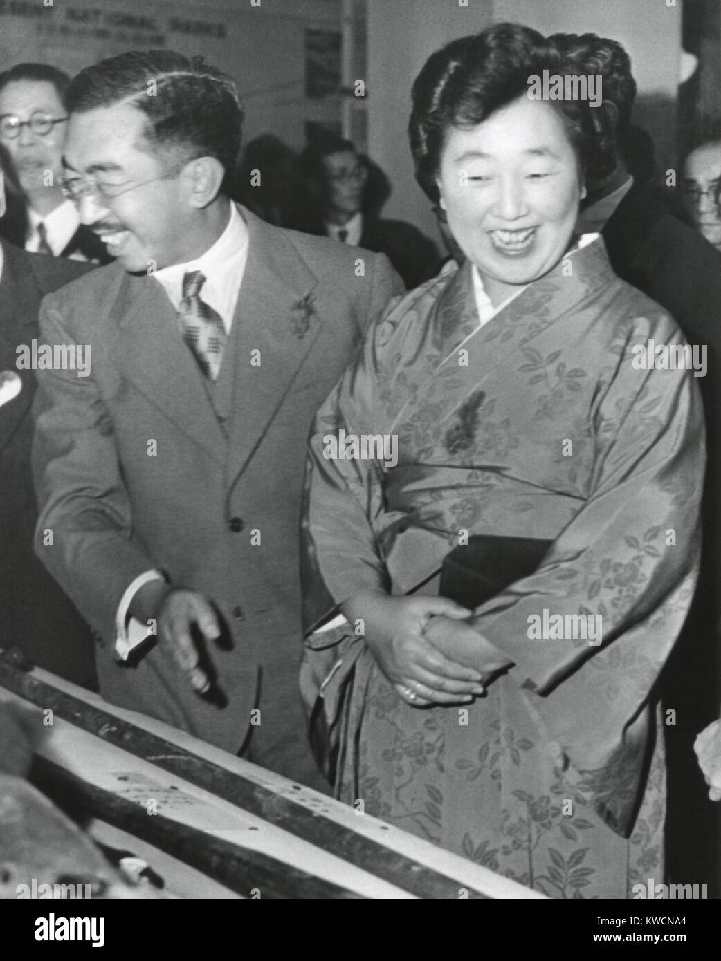 Emperor Hirohito and Empress Nagako at an exhibition at a Tokyo Department store. Oct. 27, 1949. Both wear small red feathers showing they contributed to the Japanese Community Chest Drive. - (BSLOC_2014_15_141) Stock Photo