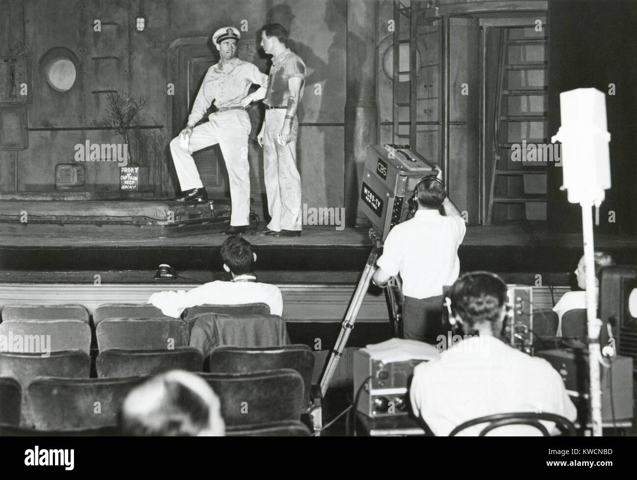 Henry Fonda plays to an audience of lights and television cameras from the Broadway stage. It is an experimental television 'first', the transmission of the stage play, 'Mr. Roberts' direct from the theater to video audience. Joe Marr played 'Dowdy' opposite Fonda, in the title role as Lt. Doug Roberts. - (BSLOC 2014 17 134) Stock Photo