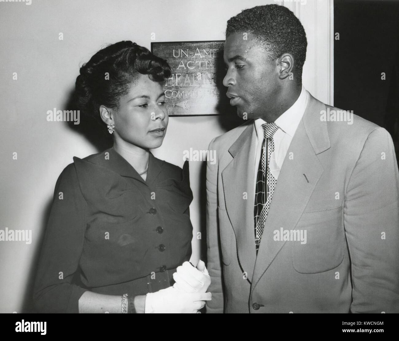 Jackie Robinson, Brooklyn baseball player and his wife Rachel outside the HUAC committee room. July 18, 1949. While he was considered a 'friendly' witness, his testimony to the House Un-American Activities included criticism of American racial violence and segregation. - (BSLOC 2014 17 167) Stock Photo