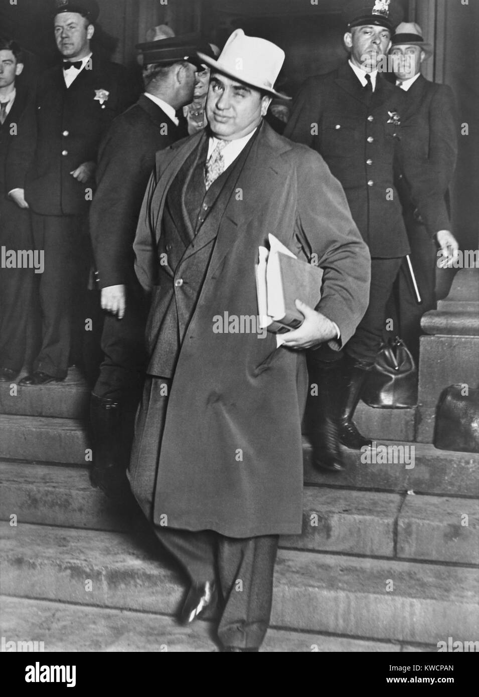 Al Capone, winks at photographers as he leaves Chicago's federal courthouse. October 14, 1931. The notorious Chicago gangster was on trial for tax evasion. - (BSLOC 2015 1 13) Stock Photo