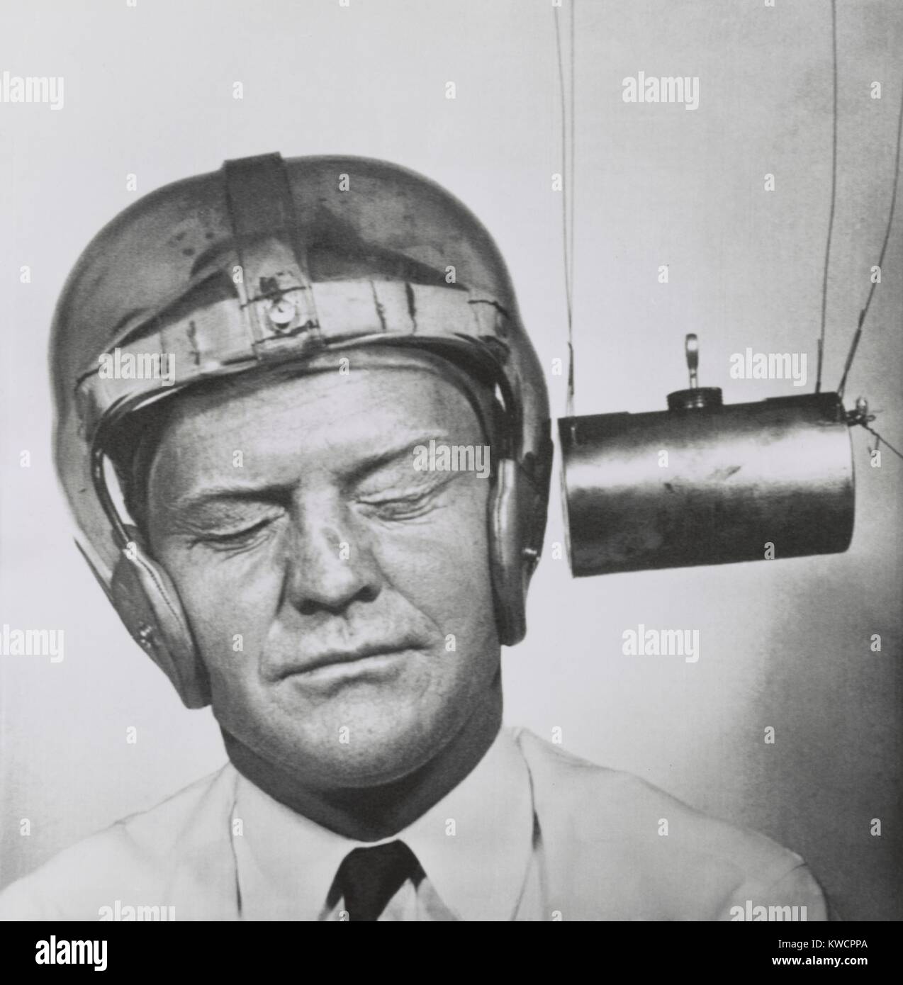 Pendulum pounding a plastic helmet worn for testing to improve headgear for football players. Sept.13, 1950 - (BSLOC_2015_1_219) Stock Photo