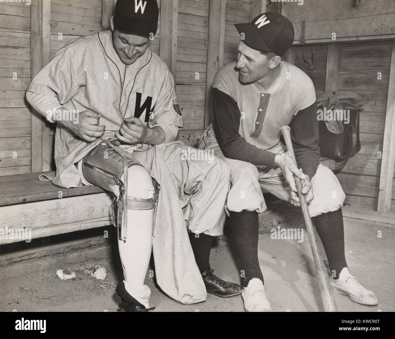 Washington Senators pitcher, Lt. Bert R. Shepard, as Manager Ossie Bluege looks on. March 30, 1945. The veteran pilot lost his lower right leg in WW2. He was the first amputee to pitch in a major league baseball game in August 1945. - (BSLOC 2014 17 168) Stock Photo