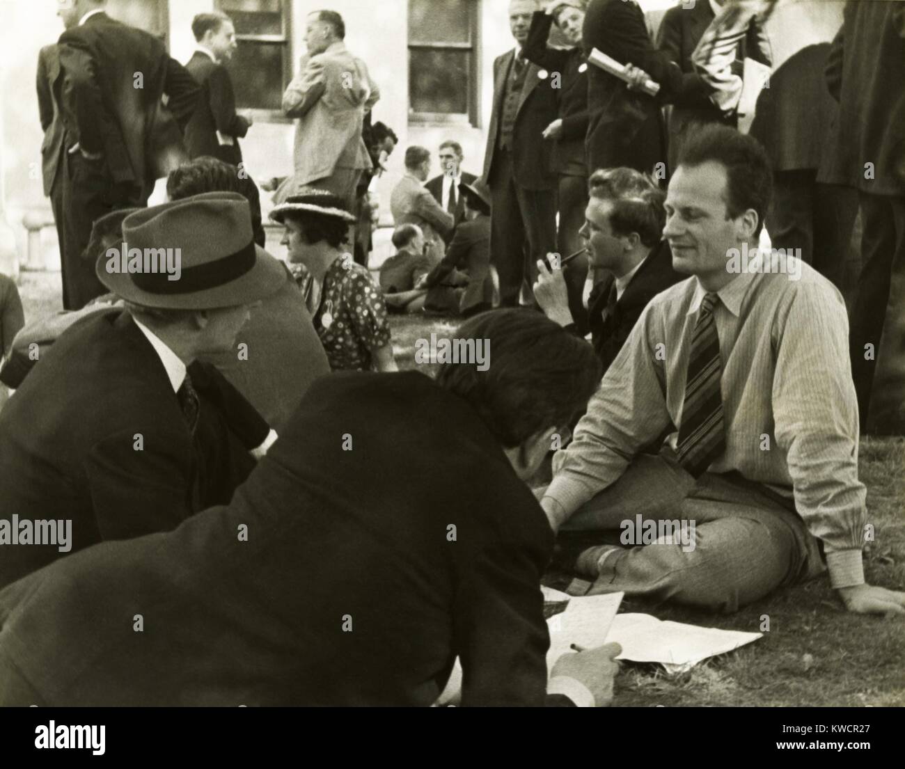 Hans Bethe, being interviewed by journalists in the late 1930s. Bethe, a German-American physicist, would win the 1967 Nobel Prize in physics for his work on the theory of stellar nucleosynthesis. - (BSLOC 2015 1 65) Stock Photo