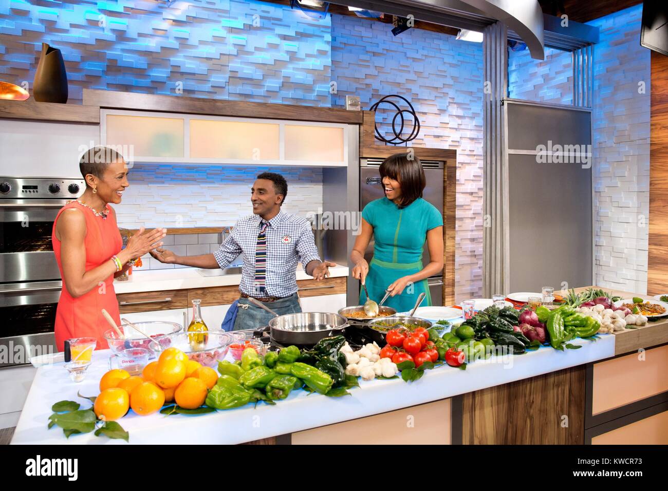First Lady Michelle Obama, 'Good Morning America' anchor Robin Roberts, and chef Marcus Samuelsson. They were promoting healthy cooking with vegetables. Feb. 22, 2013. (BSLOC 2015 3 105) Stock Photo