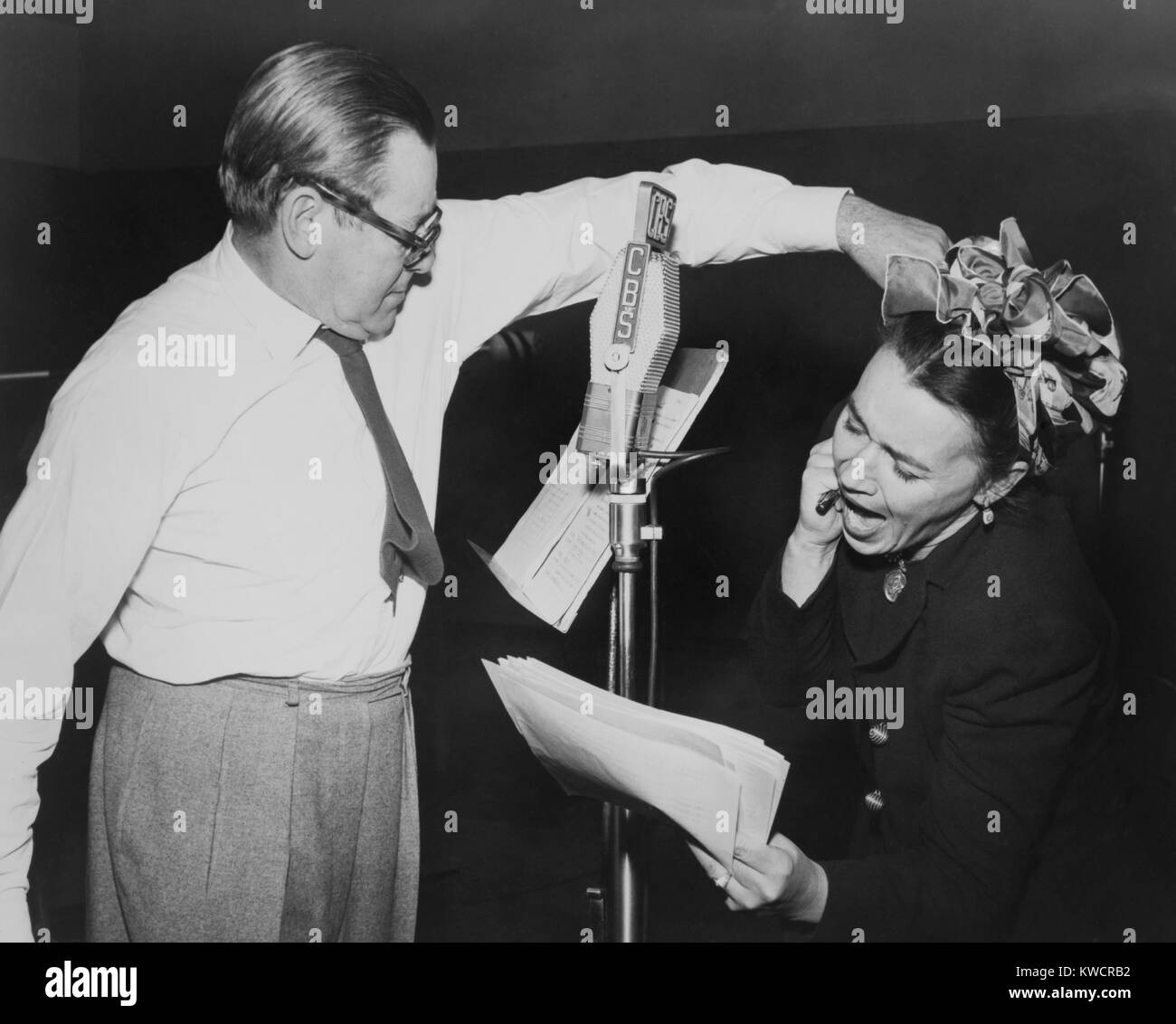 Herbert Marshall striking a blow, murdering his 'wife', in a radio play, 'Back for the Holidays'. From 1944 to 1952, Marshall starred in his own radio series, 'The Man Called X'. - (BSLOC 2014 17 87) Stock Photo