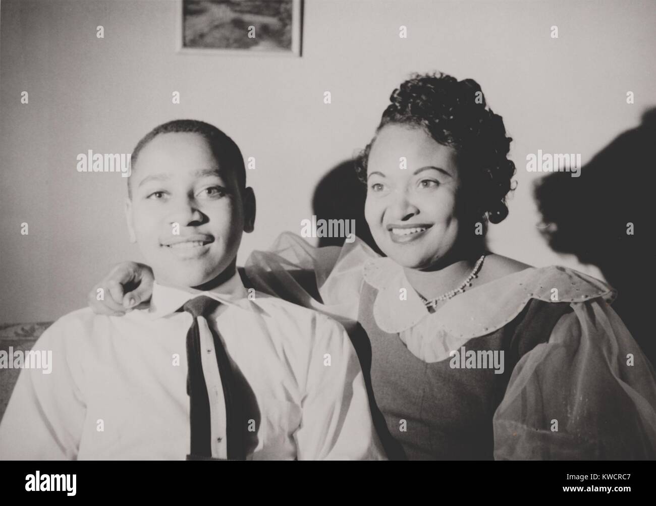 Emmett Till with his mother, Mamie Bradley, ca. 1950. To expose the horror of her 14 year-old's lynching, she ordered an open coffin funeral to show his tortured and mutilated body. - (BSLOC 2015 1 103) Stock Photo