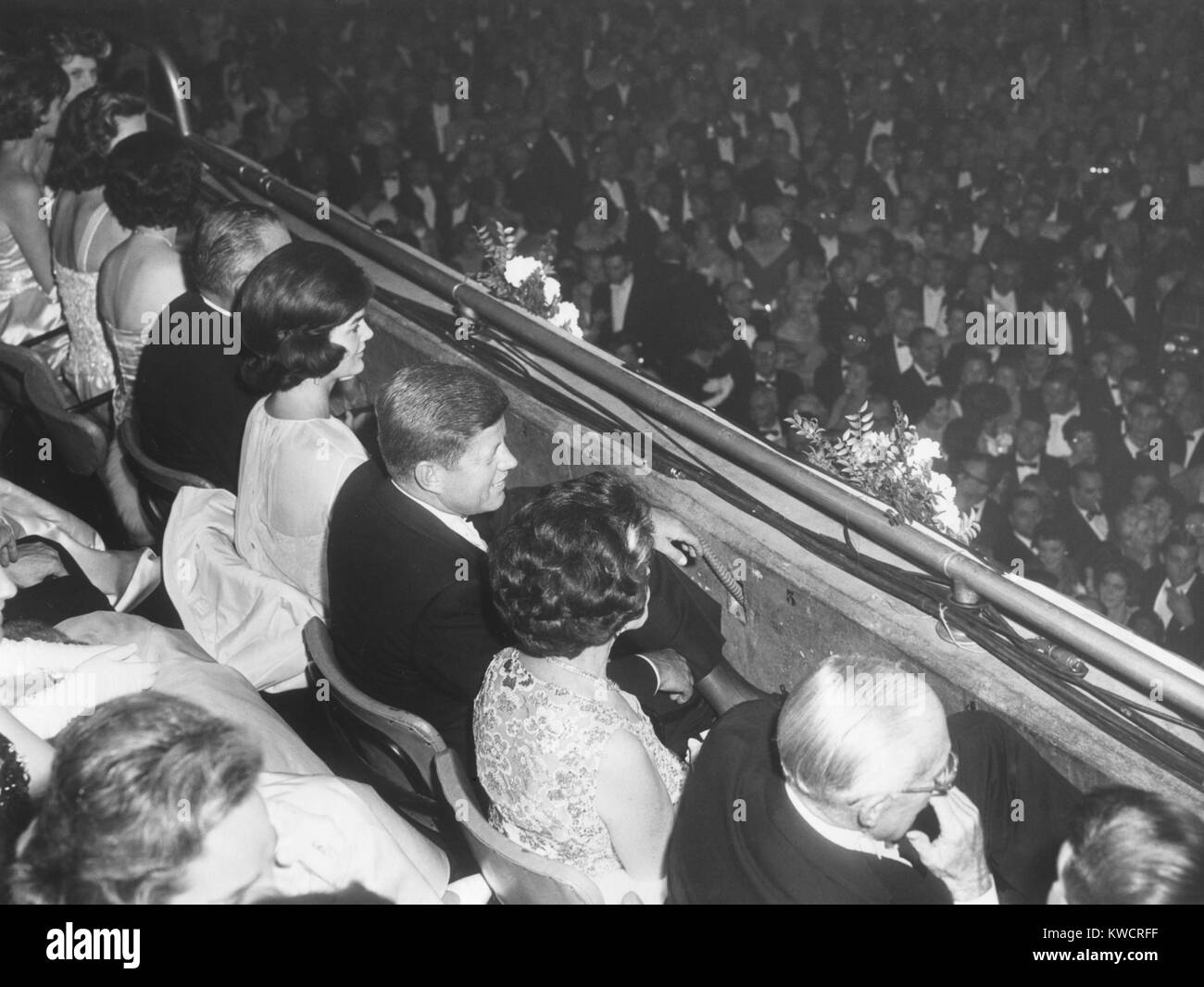 President John Kennedy and party seated in the National Guard Armory