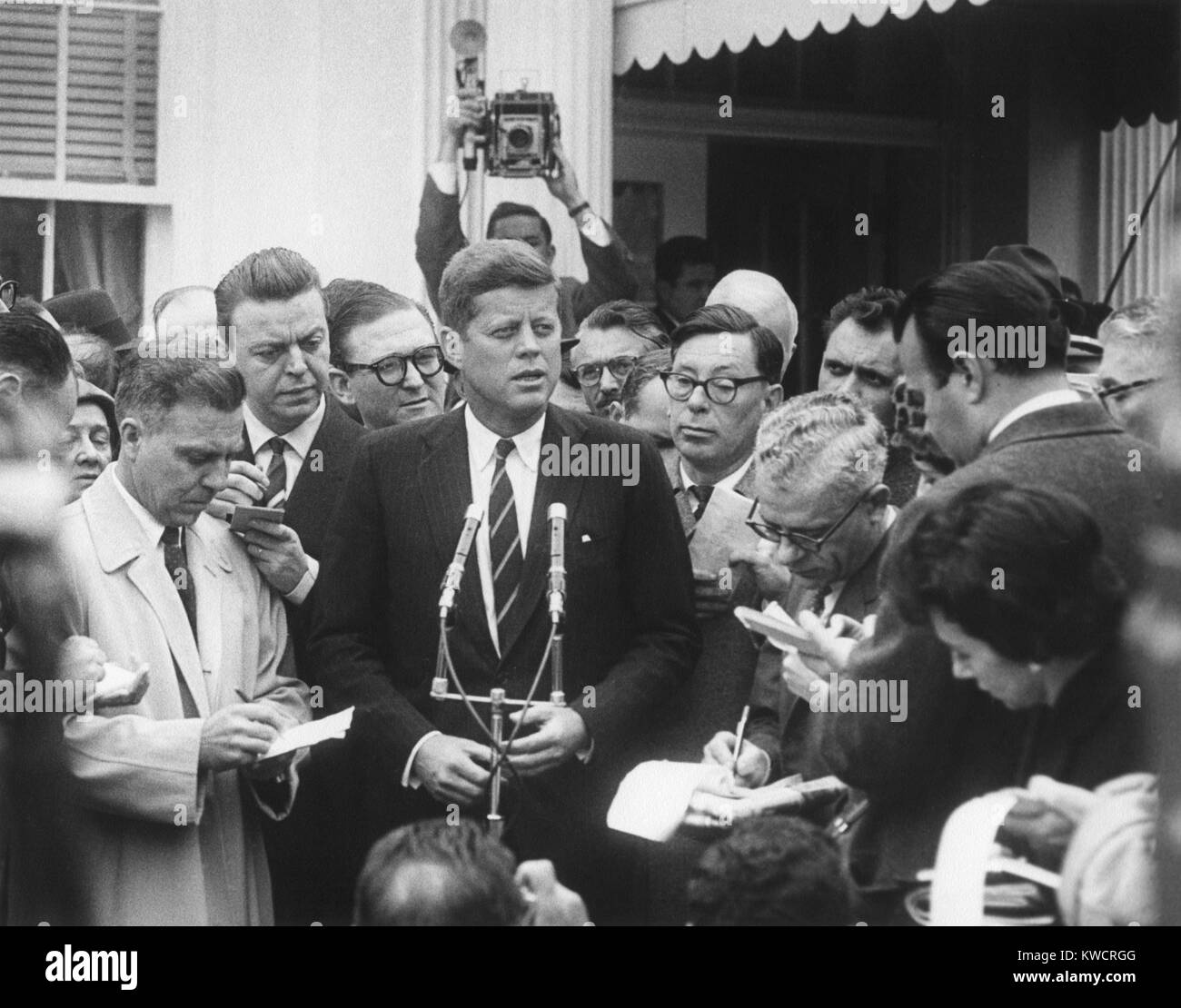 President-elect John Kennedy speaks to reporters outside the White House after his meeting with President Dwight Eisenhower. Dec. 12, 1960. - (BSLOC 2015 1 152) Stock Photo