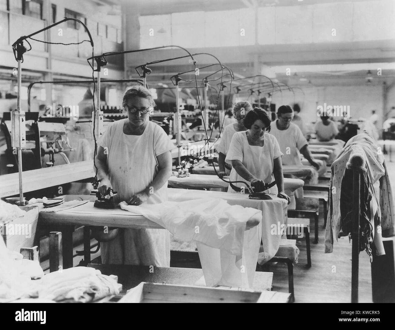 Older women doing hand ironing in a laundry, ca. 192535. (BSLOC 2015
