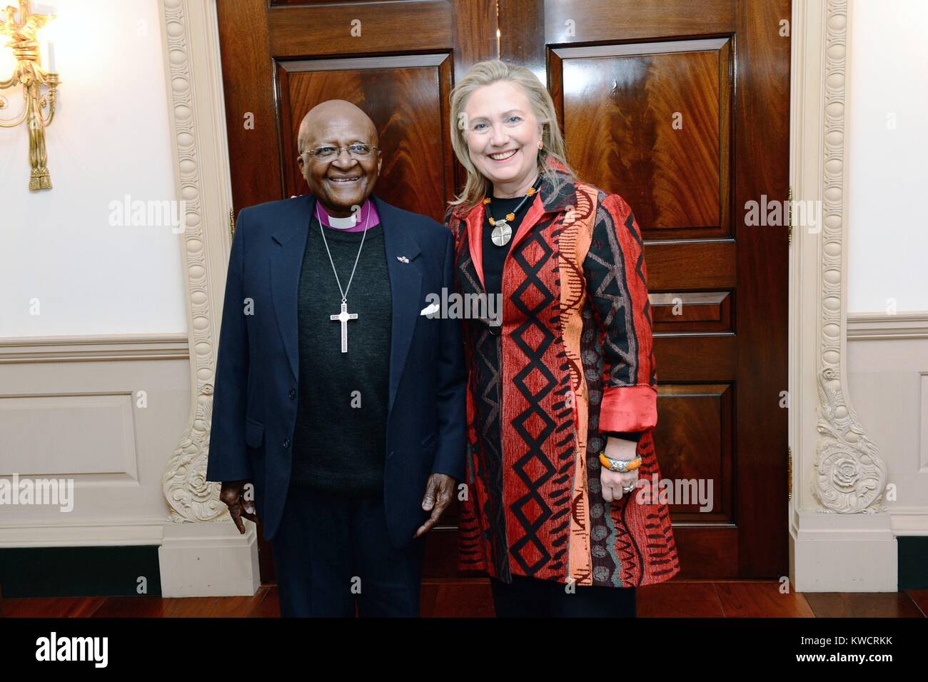 Secretary of State Hillary Rodham Clinton meets with Archbishop Desmond Tutu. Oct. 10, 2012. Tutu was the first black Archbishop of Cape Town of the Anglican Church of Southern Africa. He received the Nobel Peace Prize in 1984 for his opposition to apartheid. (BSLOC 2015 3 66) Stock Photo