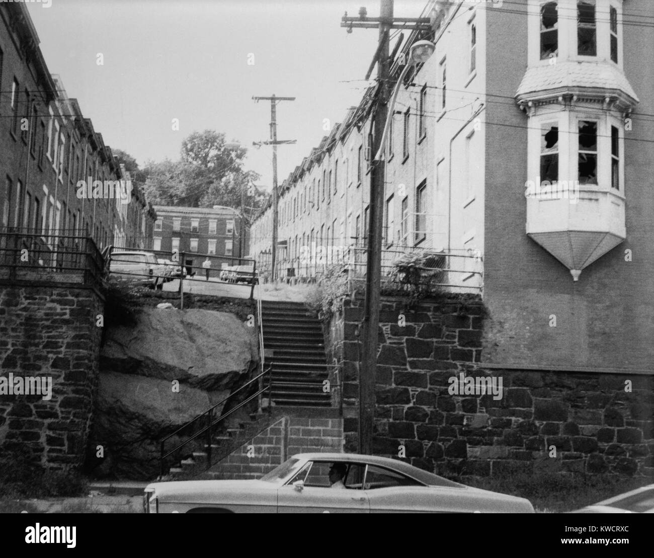 Yonkers, New York, ca. 1980. Moquette Row Housing, are 18th century industrial housing built for workers of Moquette Textile Mills in the 1880's. View west showing front elevation and original end structures. Westchester County, NY. (BSLOC 2015 11 10) Stock Photo