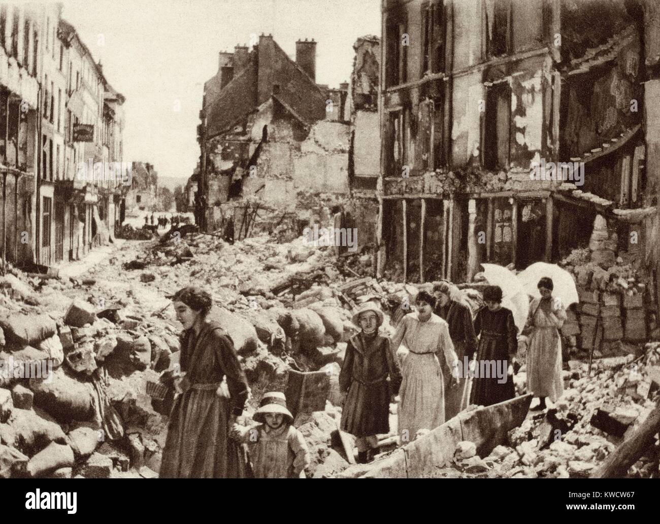 World War 1. Women and children who had been hiding in the cellars of Chateau-Thierry, France, emerging after the Allies liberated the city in July 1918. (BSLOC 2013 1 186) Stock Photo