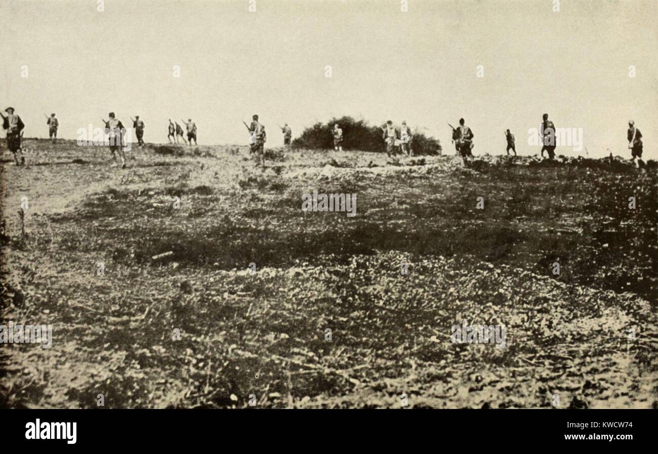 World War 1. American infantry advancing under fire on the Western Front in 1918. In their first battles, U.S. troops made frontal assaults into machine gun fire, which the Europeans had abandoned in favor of more cautious defensive tactics. (BSLOC 2013 1 197) Stock Photo