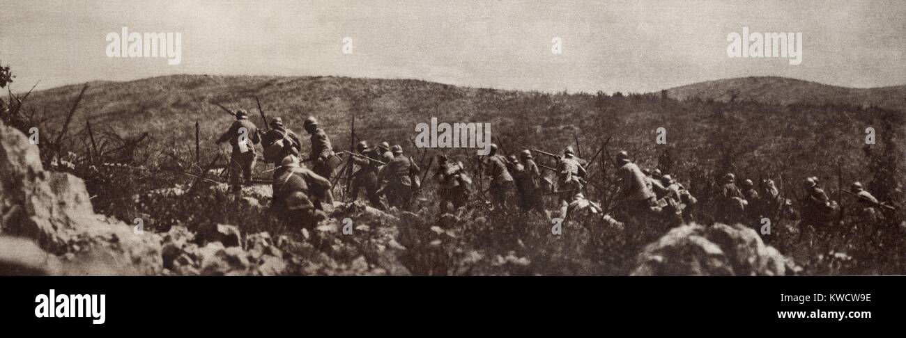 World War 1 on the Italian-Austrian front. Company of Italian Grenadiers advancing over rock-strewn ground of the Asiago Plateau to attack a strongly defended Austrian position. Fighting occurred in this area from 1916 through 1918. (BSLOC 2013 1 30) Stock Photo