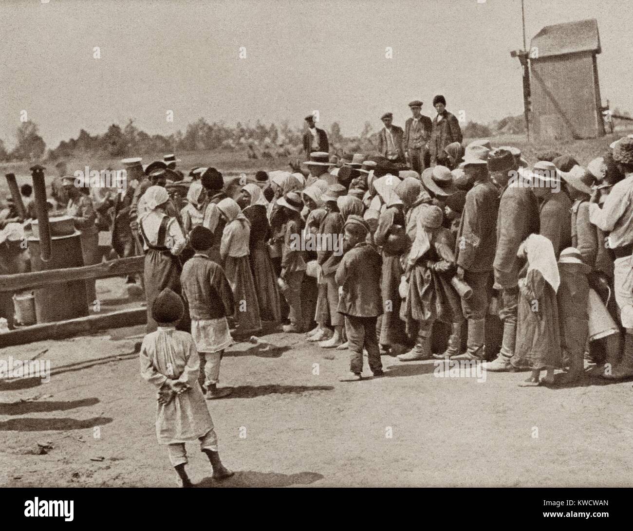 World War 1 in Eastern Europe. Peasants in retreat from Warsaw wait for a meal at a food depot established by the Russians. 1914-15. (BSLOC 2013 1 5) Stock Photo