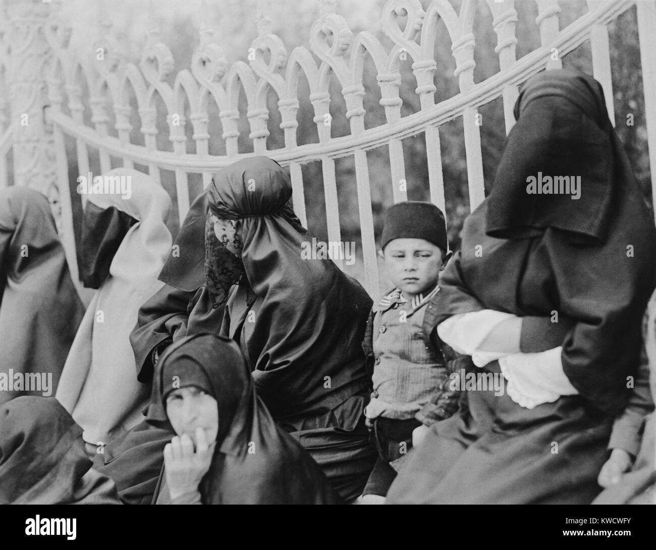 Veiled Islamic women in Constantinople in 1919. In the 1920s, the new Turkish leader, Kemal Ataturk, allowed women the freedom to wear modern clothing (BSLOC 2017 1 116) Stock Photo