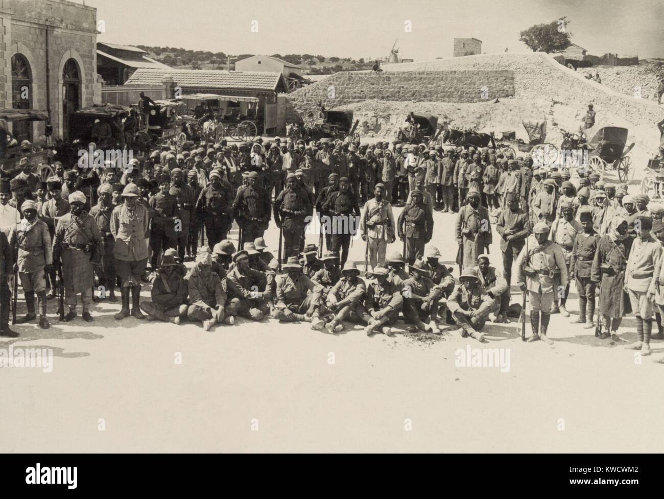 Seated Australian POWs captured at Shellal in the First Battle of Gaza, March 26, 1917. Soldiers of the Egyptian Expeditionary Force are surrounded by their victorious Ottoman Turkish captors. (BSLOC 2017 1 160) Stock Photo