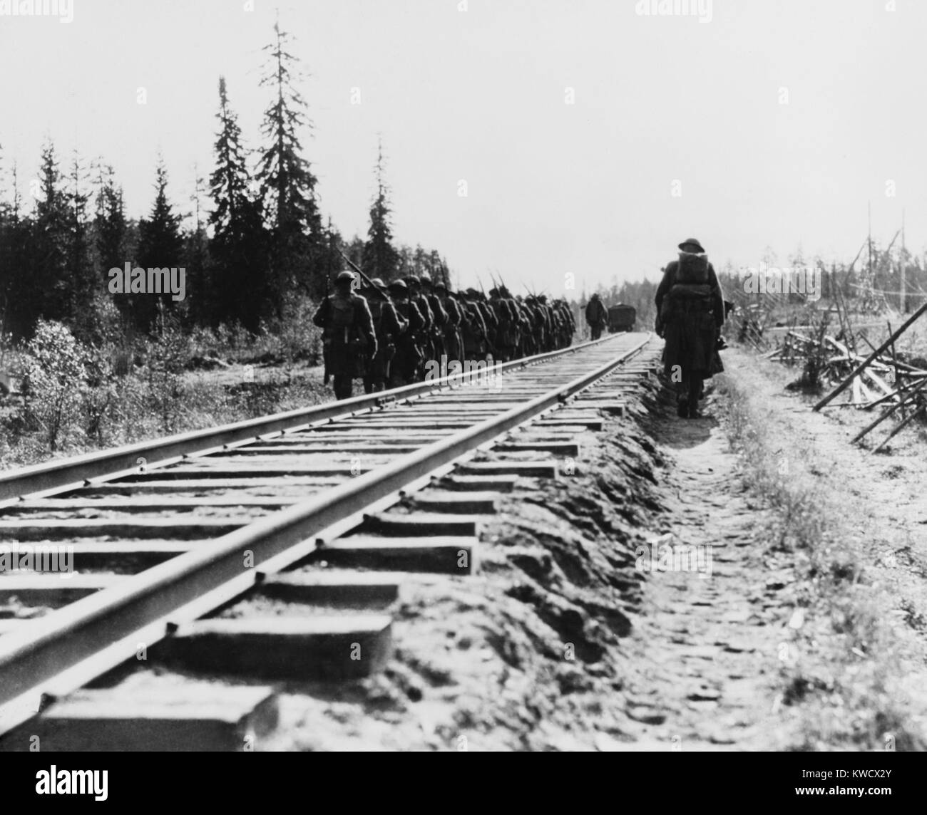 US Infantry, marching along railway lines during the Russian Intervention, 1918-20. Their mission was to protect the Siberian Railway while maintaining American neutrality during Russian Revolution and Civil War (BSLOC 2017 2 12) Stock Photo