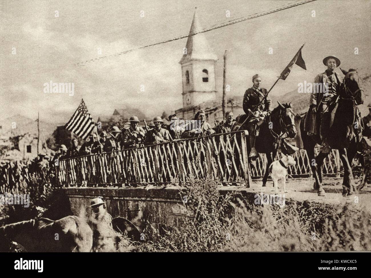 World War 1: Battle of St. Mihiel. Company of American Engineers, with colors flying, passing through the French town of Nonsard. Sept. 12-16, 1918. (BSLOC 2013 1 202) Stock Photo