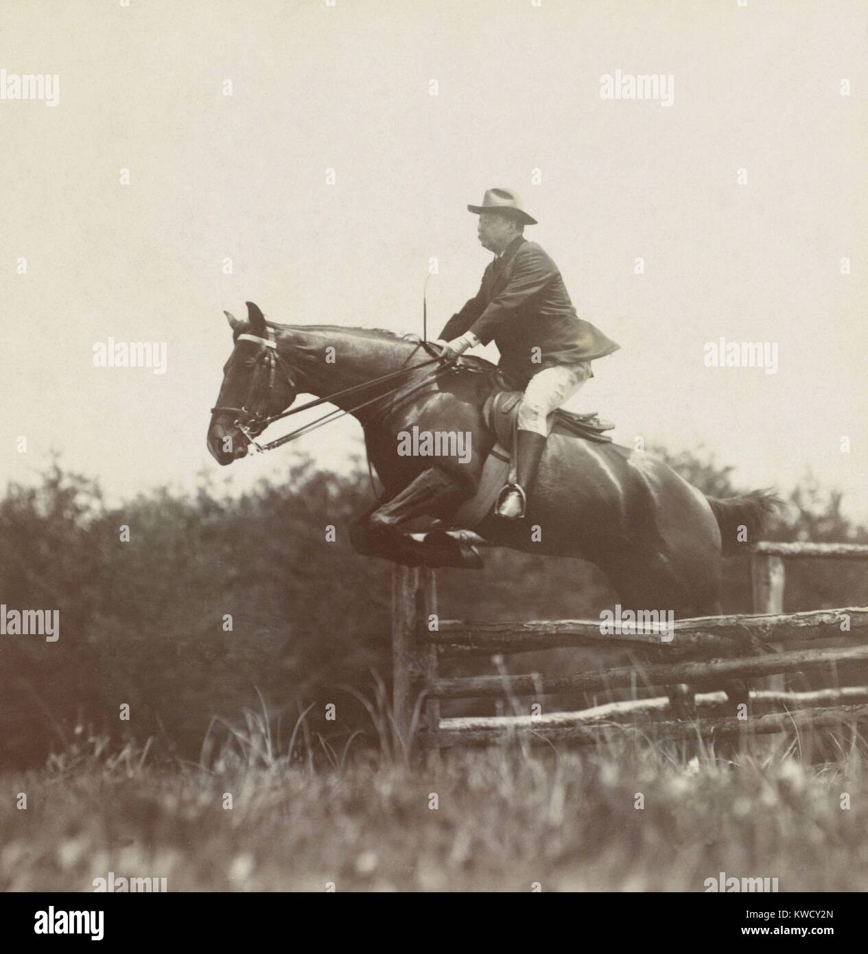President Theodore Roosevelt, on horseback jumping over wood fences at Chevy Chase Club, 1907. Photo by B.F. Clinedinst (BSLOC 2017 4 95) Stock Photo