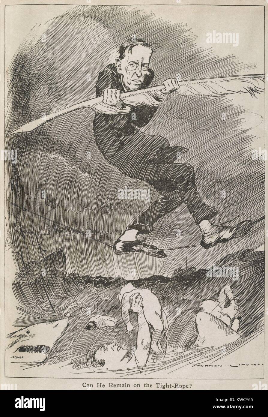 CAN HE REMAIN ON THE TIGHT-ROPE? President Woodrow Wilson balancing with a quill pen, on a tightrope over a shark infested Atlantic Ocean and victims of German submarine warfare. 1917 by Australian cartoonist, Norman Lindsay (BSLOC 2017 1 36) Stock Photo
