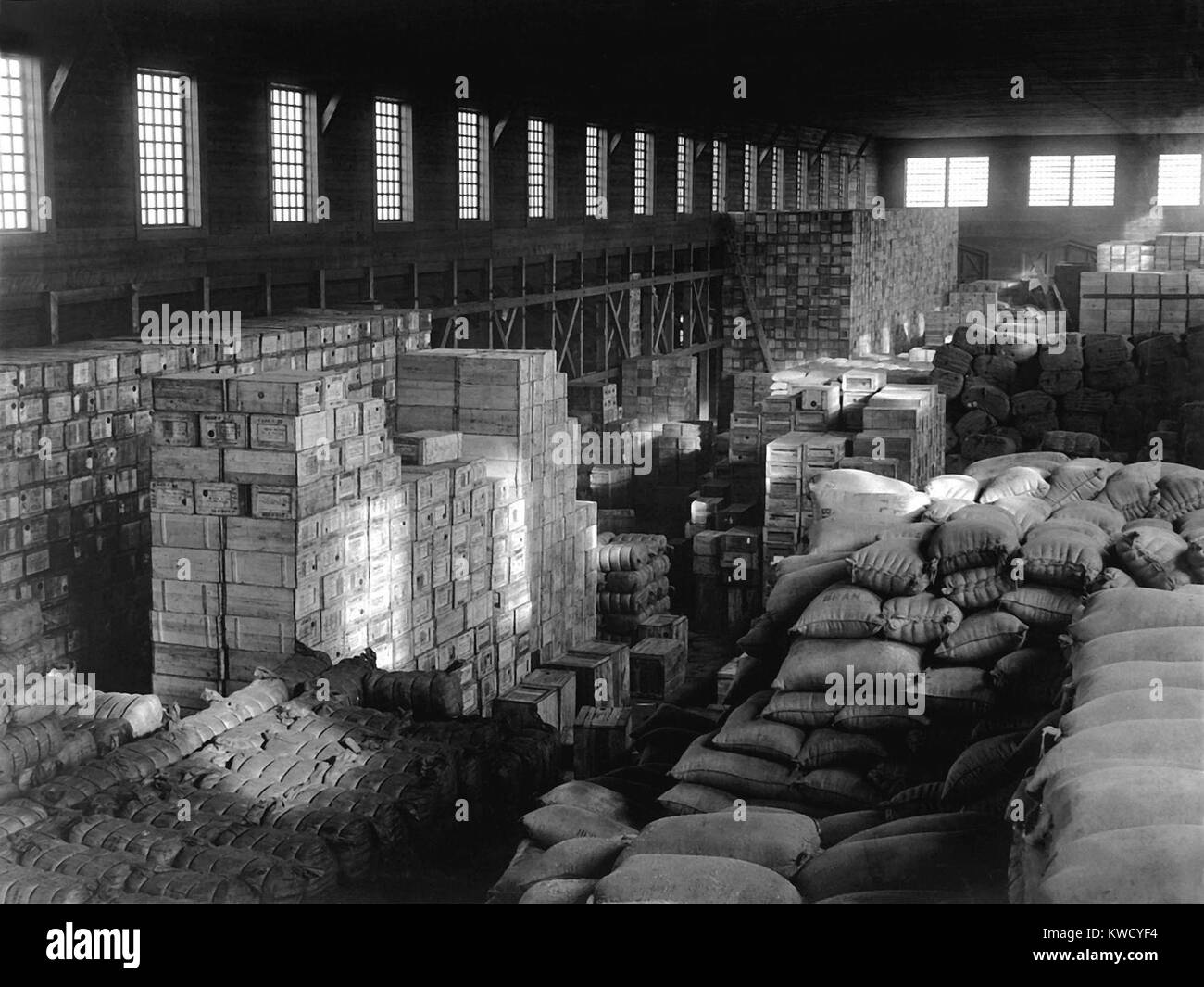 Quartermaster supplies in warehouse at Vladivostok, containing American war material. Protecting this property was one of the missions of the American North Russian Expeditionary Force 1918-1920. After the fall of Czarist Russia, a billion dollars worth of American guns and equipment were abandoned along the Trans-Siberian Railway between Vladivostok and Nikolsk (Ussuriysk) (BSLOC 2017 2 14) Stock Photo