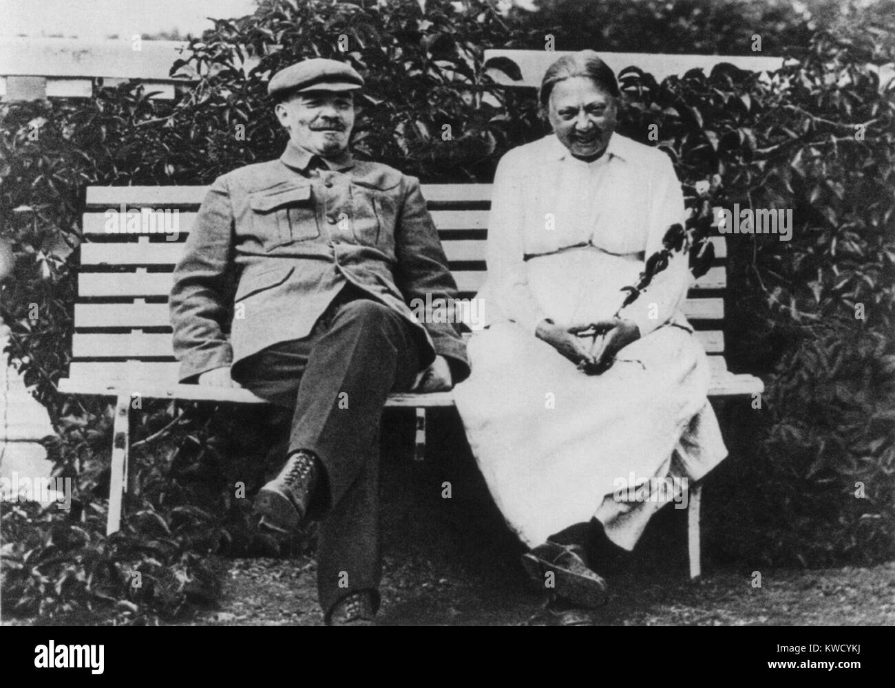 Lenin and his wife Krupskaya sit together in their dacha garden at Gorki, August 1922. Lenin was convalescing from a May 1922 stroke and returned to work in Moscow in October. He had a second stroke in Dec. 1922, followed by a third in March 1923, which left him an invalid until his death in March 1924 (BSLOC 2017 2 21) Stock Photo