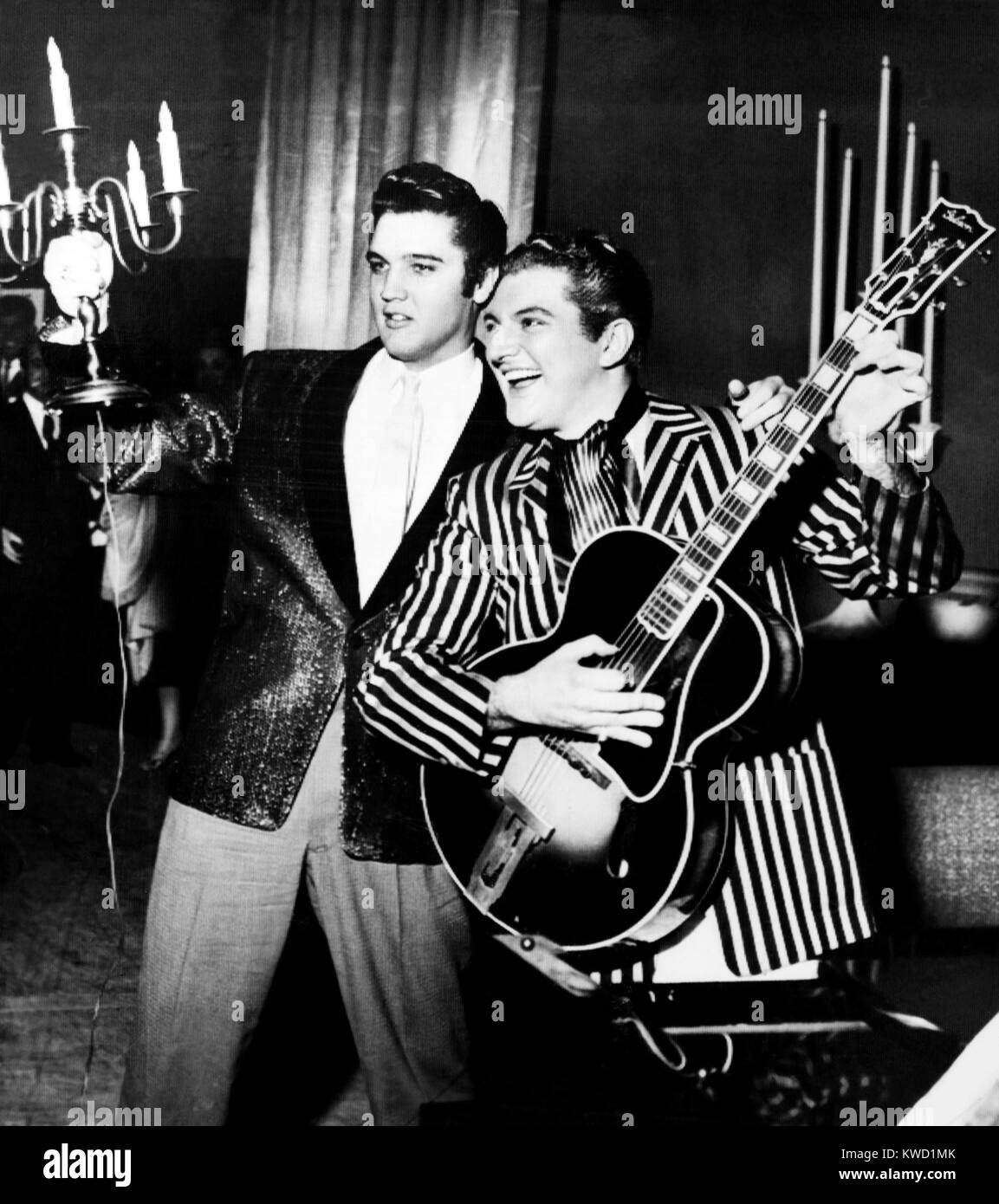 From left: Elvis Presley holding candelabra, Liberace with guitar